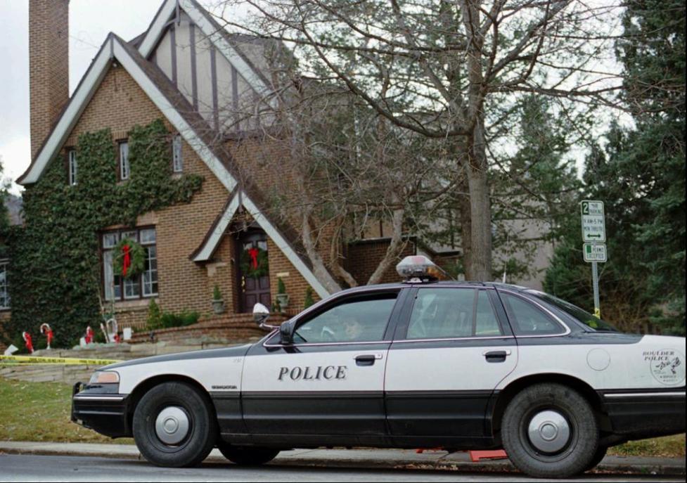 A police car outside a house.