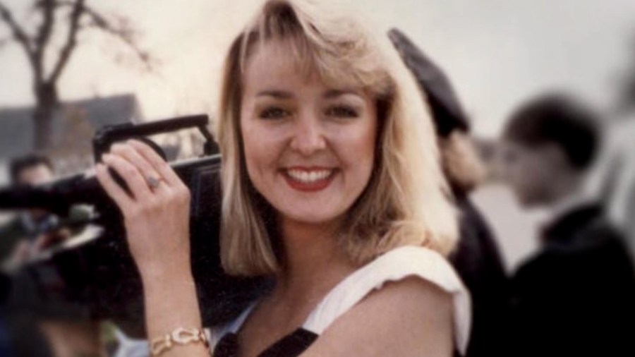 Jodi Huisentruit is pictured holding a camera.