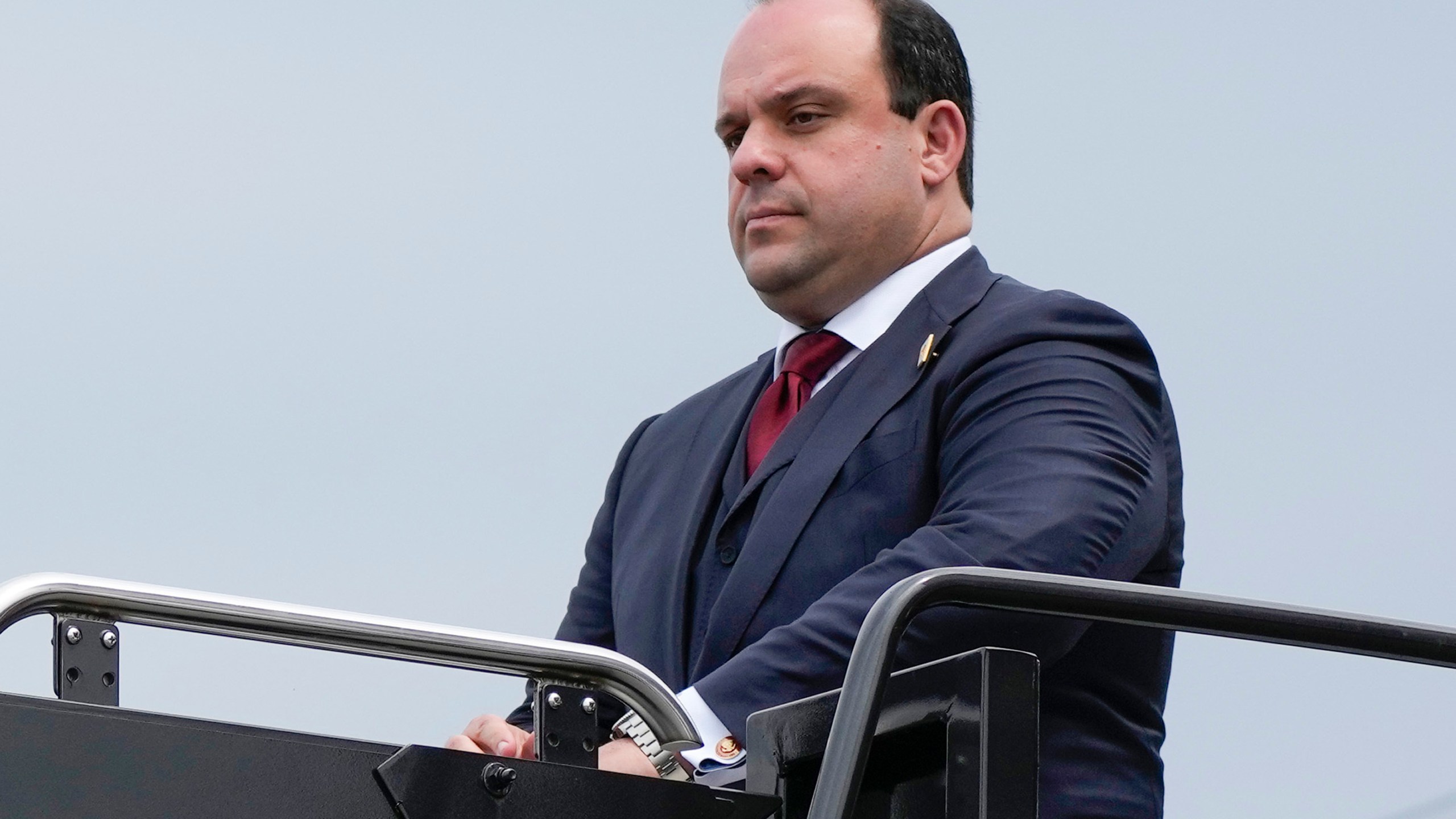 FILE - Boris Epshteyn arrives with former President Donald Trump at Ronald Reagan Washington National Airport, Aug. 3, 2023, in Arlington, Va. Police records show that Epshteyn, a longtime aide to Trump, was arrested in 2021 after he was accused of repeatedly groping two women in a nightclub in Scottsdale, Ariz. (AP Photo/Alex Brandon, File)