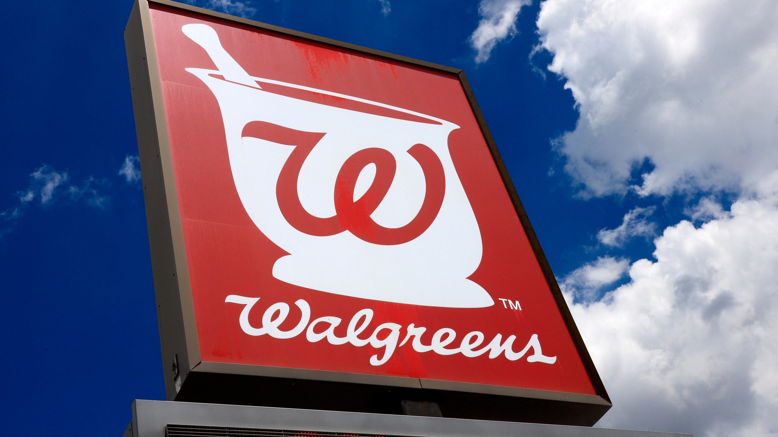 FILE - A Walgreens Pharmacy sign is seen, June 25, 2019, in Pittsburgh. Walgreens has been fined $275,000 by the state of Vermont as part of a settlement of complaints that some of national pharmacy chain's Vermont stores unexpectedly closed, had untenable working conditions for pharmacists, and made medication and vaccination errors during the coronavirus pandemic, the secretary of state announced Wednesday, Jan. 24, 2024. (AP Photo/Gene J. Puskar, File)