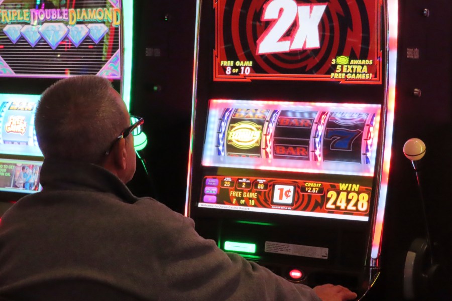 A gambler plays a slot machine at the Ocean Casino Resort in Atlantic City, New Jersey.