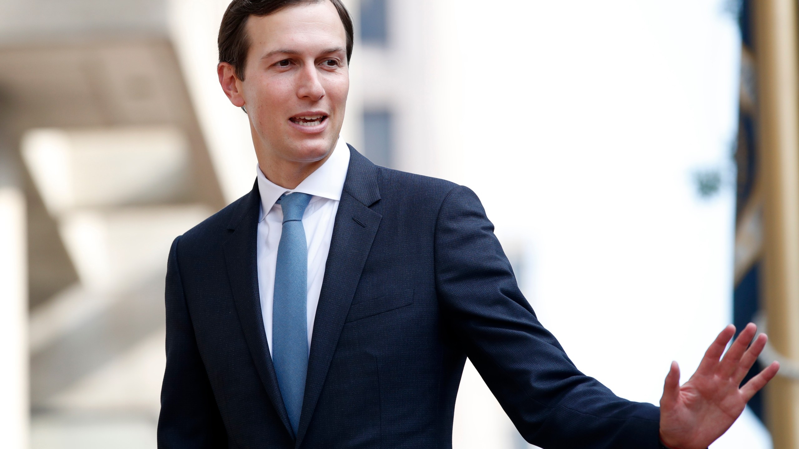 FILE - Jared Kushner waves as he arrives at the Office of the United States Trade Representative for talks on trade with Canada, Aug. 29, 2018, in Washington. Kushner, Donald Trump's former White House adviser and his son-in-law, praised the "very valuable" potential of Gaza's "waterfront property." Kushner in an interview with a Harvard University professor last month suggested that Israel should remove civilians while it "cleans up" the area. (AP Photo/Jacquelyn Martin, File)