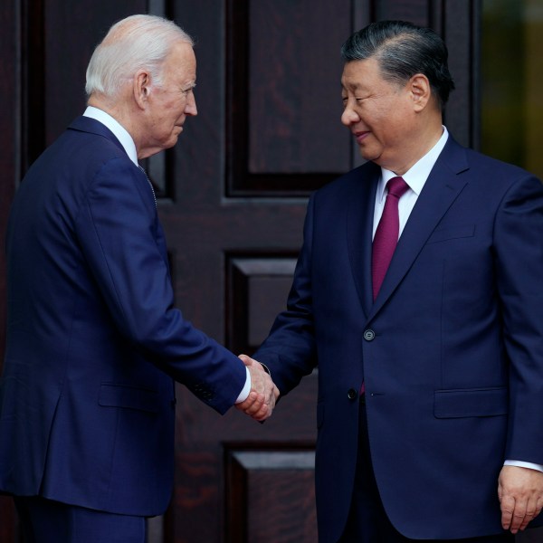 FILE - President Joe Biden, left, greets China's President President Xi Jinping, right, in Woodside, USA, Nov. 15, 2023. High-level envoys from the United States and China are set to meet in Geneva for talks about artificial intelligence including the risks of the technology and ways to set shared standards to manage it. The meeting Tuesday is billed as an opening exchange of views in an inter-governmental dialogue on AI agreed during a meeting between U.S. President Joe Biden and Chinese President Xi Jinping in San Francisco. (Doug Mills/The New York Times via AP, Pool, File)