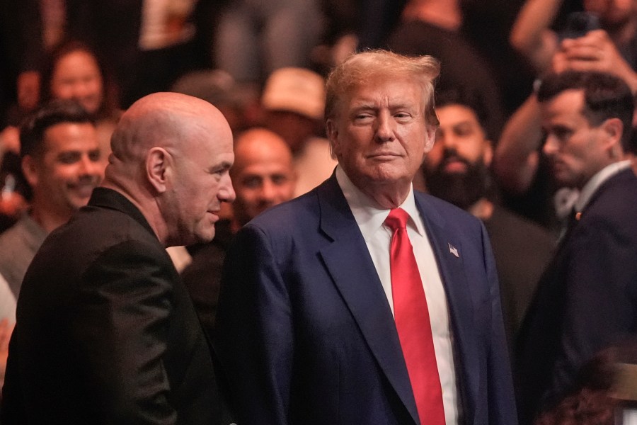 Former President Donald Trump, right, talks to Dana White.