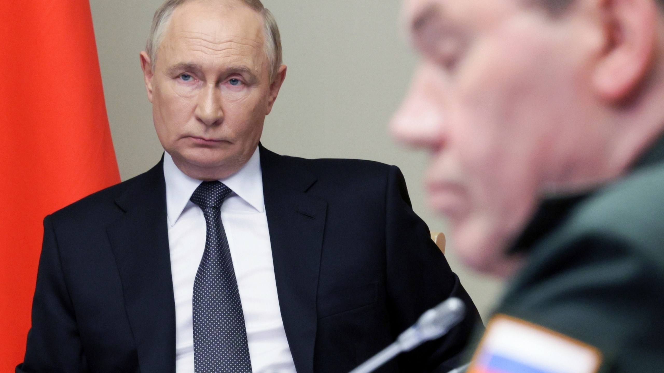 FILE - Russian President Vladimir Putin, left, leads a meeting with top security and defense officials at the Novo-Ogaryovo state residence outside of Moscow, Russia, on Aug. 12, 2024, to discuss the fighting in the Kursk and Belgorod border regions of Russia. (Gavriil Grigorov, Sputnik, Kremlin Pool Photo via AP, File)