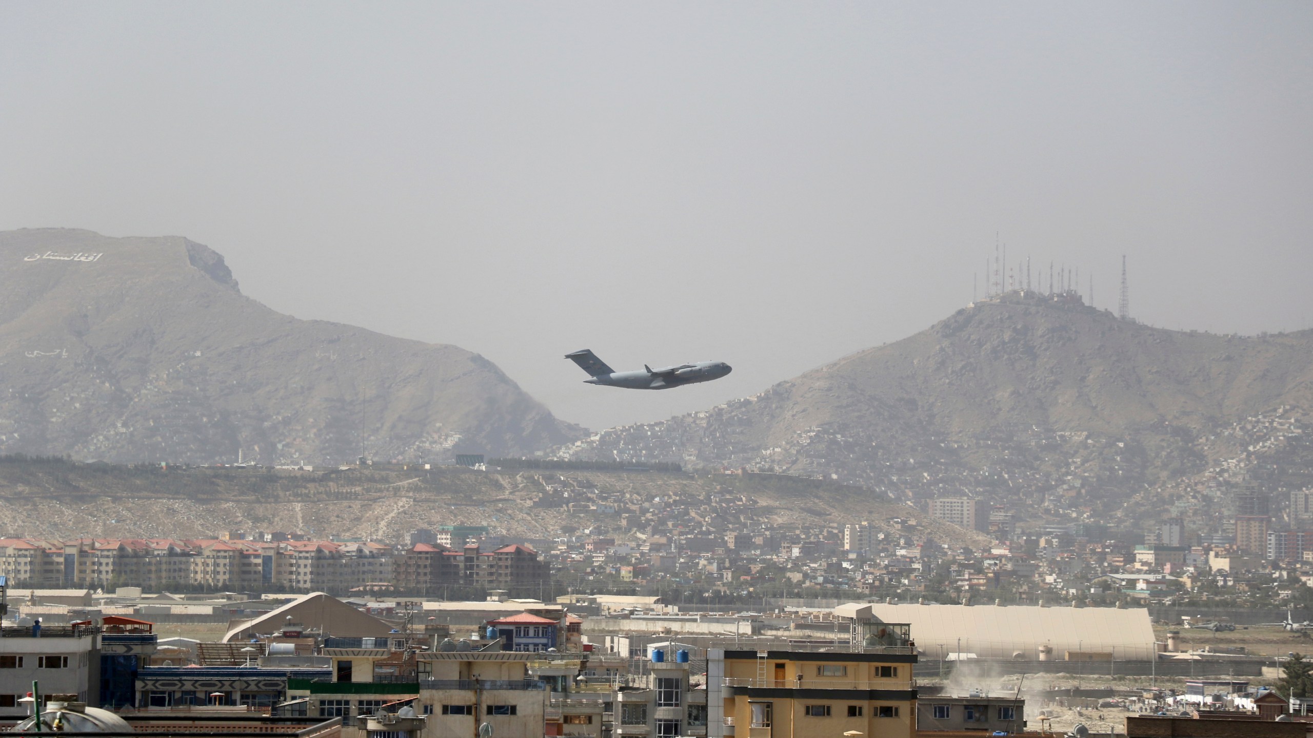FILE - U.S military aircraft takes off at the Hamid Karzai International Airport in Kabul, Afghanistan, Saturday, Aug. 28, 2021. (AP Photo/Wali Sabawoon, File)