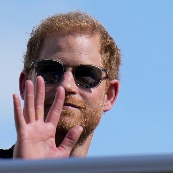 Prince Harry waves during the Formula One U.S. Grand Prix auto race on Oct. 22, 2023, in Austin, Texas.