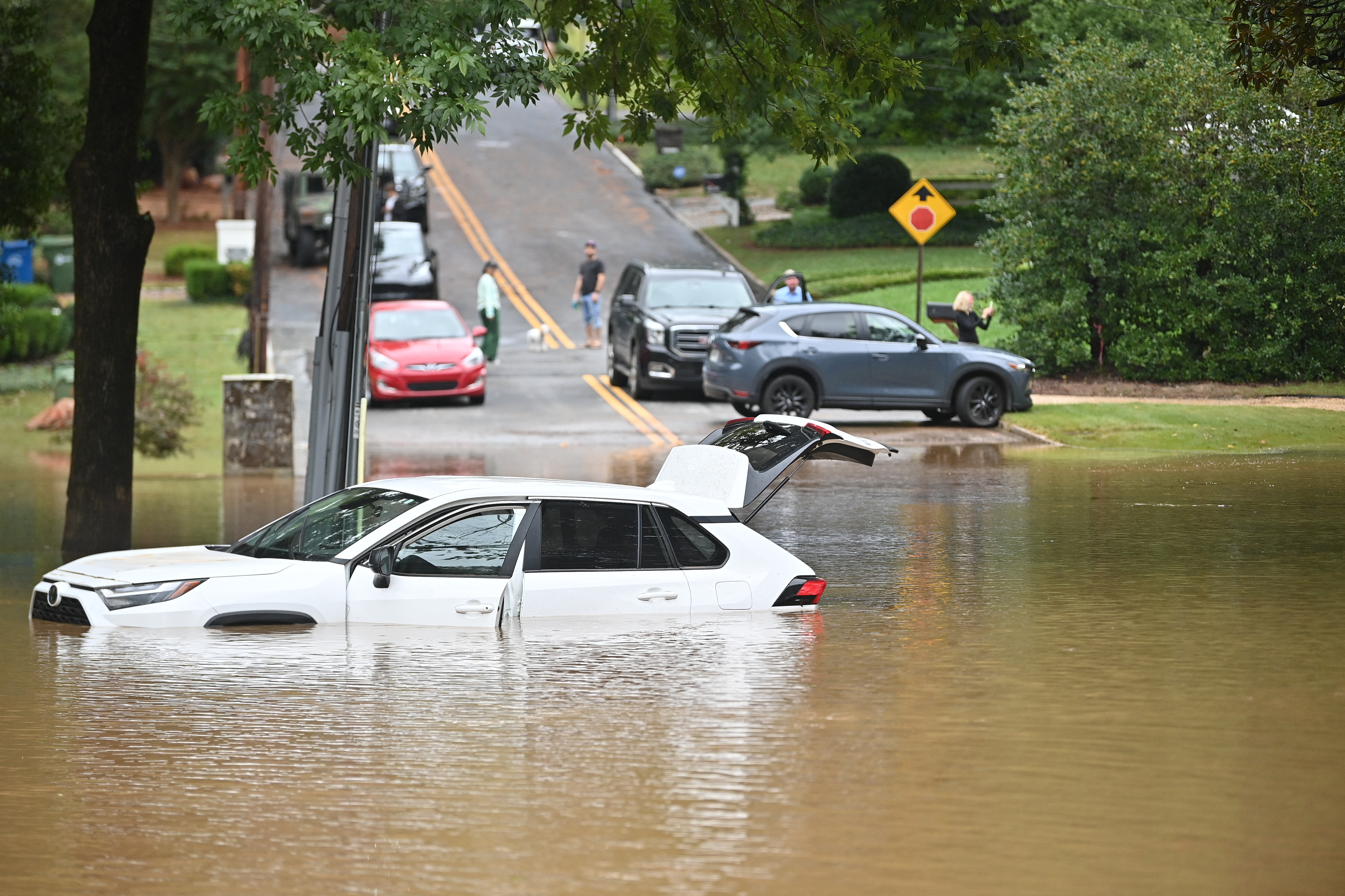 A car in a flooded street is seen after Hurricane Helene made landfall in Atlanta, Georgia, on September 27, 2024.