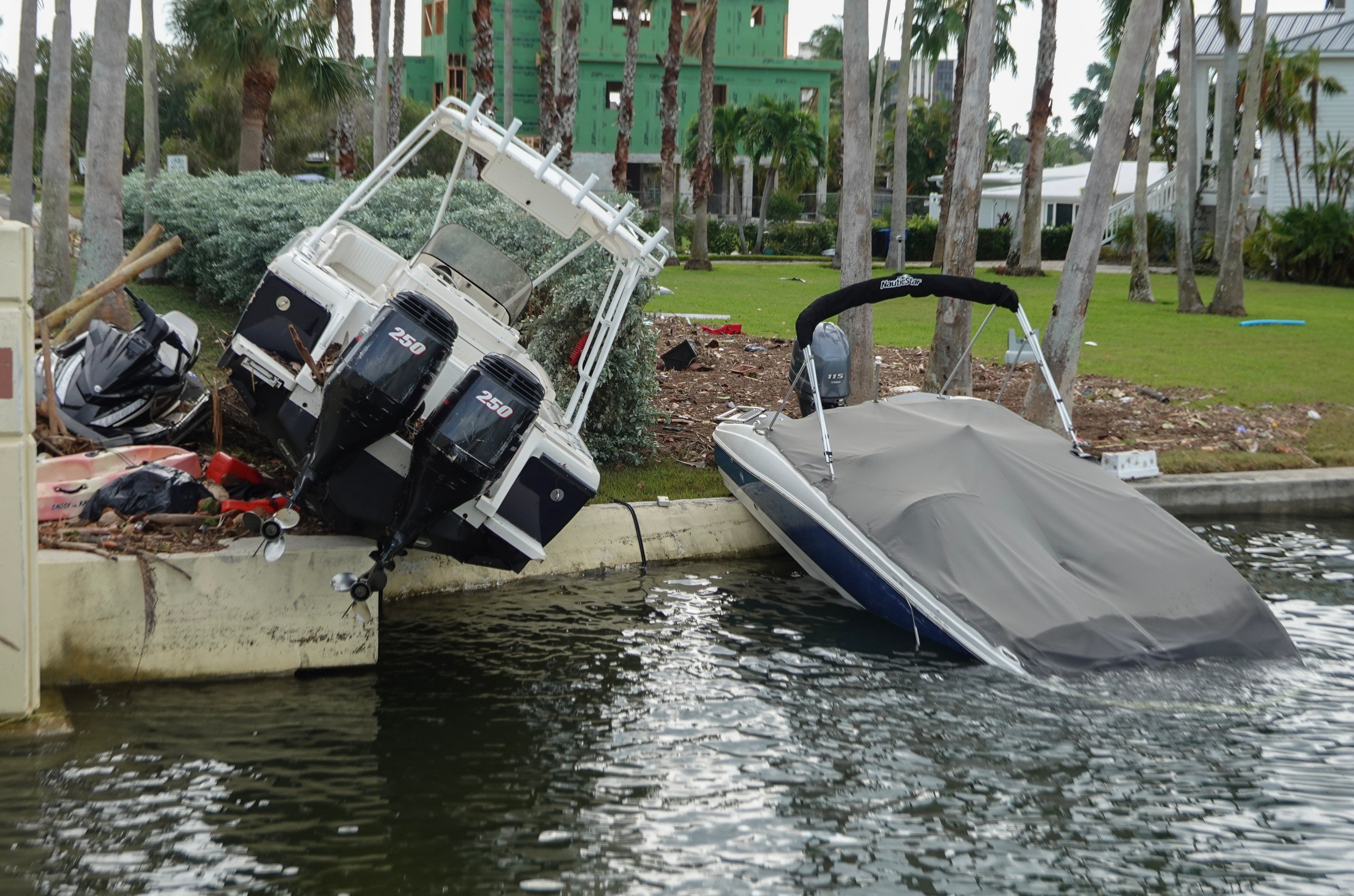 A boat lays on the shoreline after Hurricane Helene hit the area with high surge waters as it passed offshore on September 28, 2024 in Treasure Island, Florida.