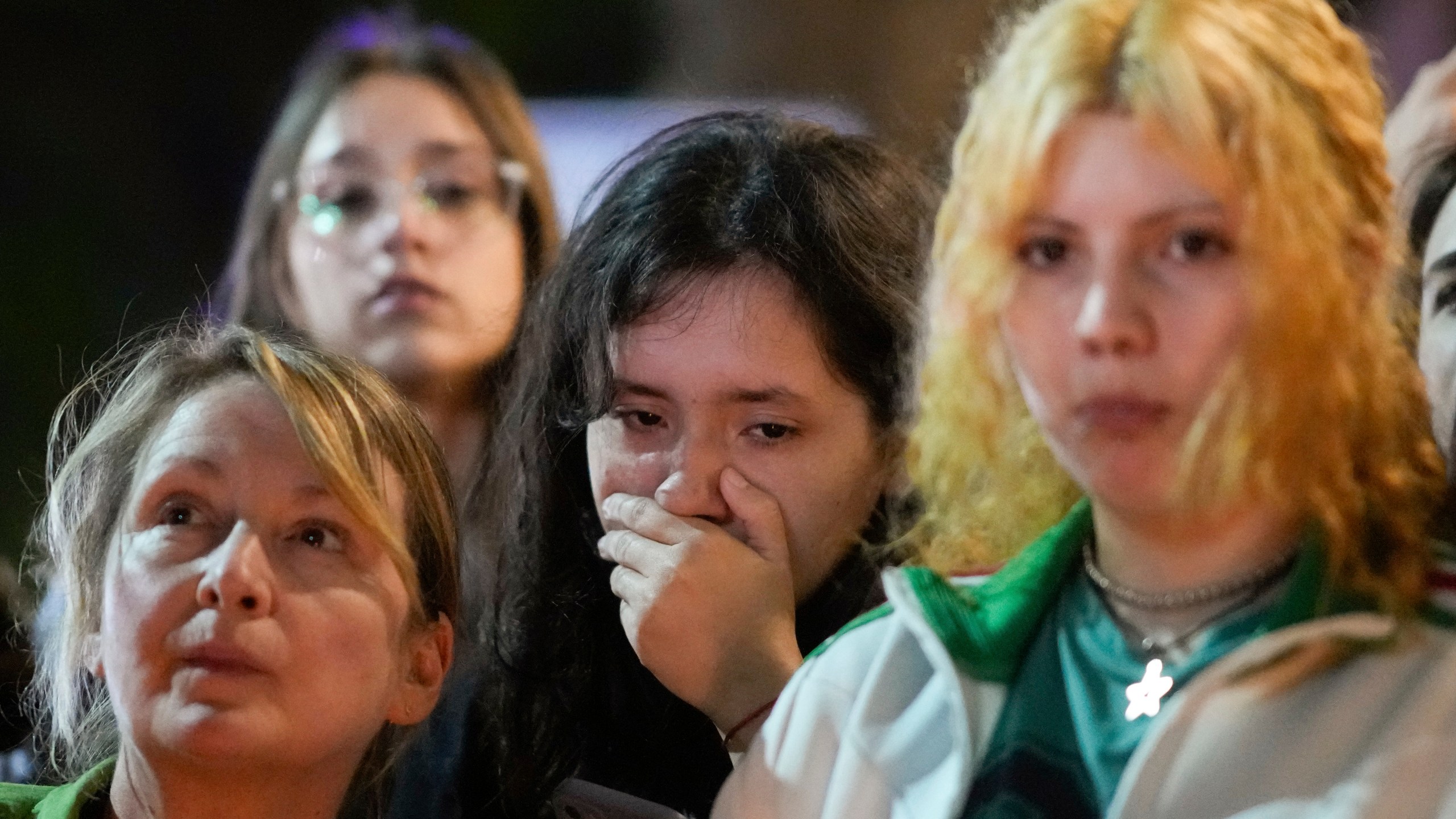 People gather outside the hotel where former One Direction singer Liam Payne was found dead after he fell from a balcony in Buenos Aires, Argentina, Wednesday, Oct. 16, 2024. (AP Photo/Natacha Pisarenko)
