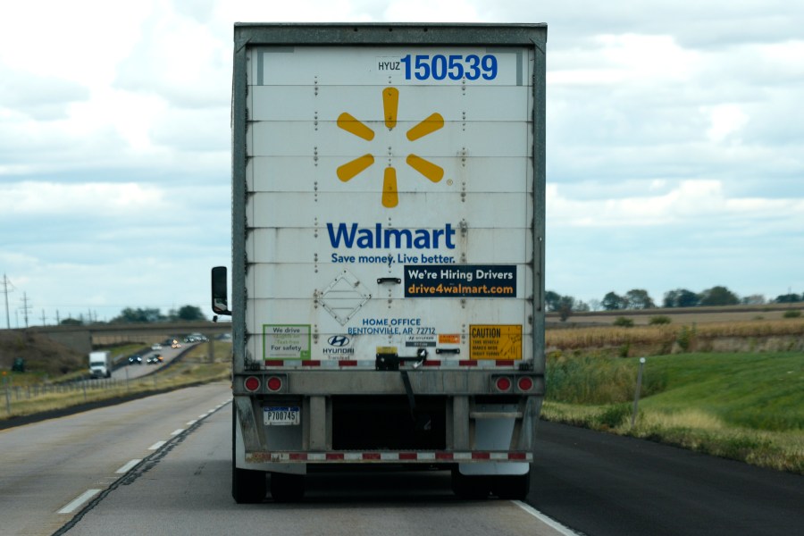 The Walmart truck fleet has We're Hiring Drivers signage on the back of the truck on I-88 road in Franklin Grove, Ill., Monday, Oct. 14, 2024. (AP Photo/Nam Y. Huh)
