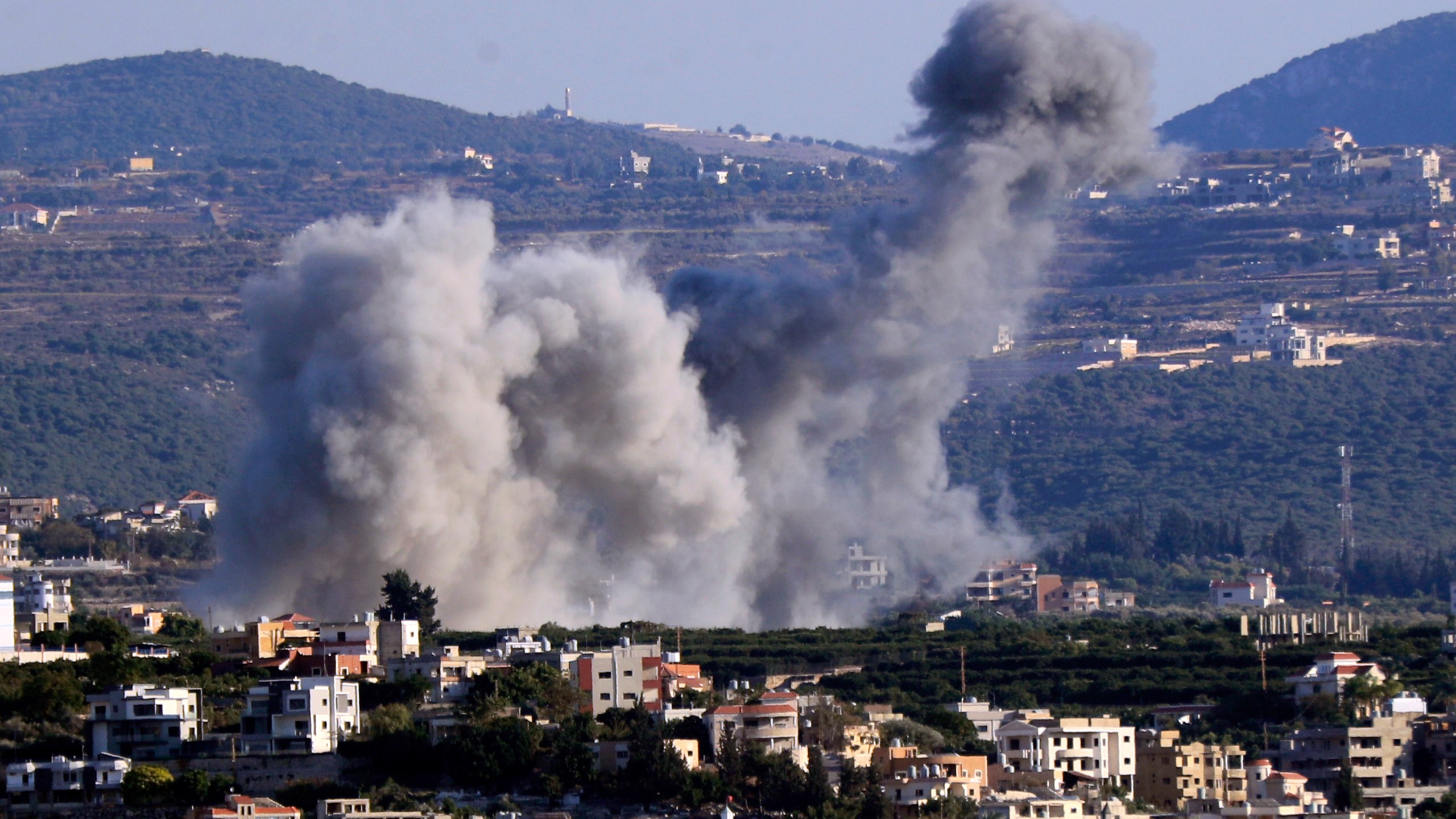 Smoke rises from an Israeli airstrike on Majdal Zoun village, in this view from the southern city of Tyre, south Lebanon, Thursday, Oct. 24, 2024. (AP Photo/Mohammed Zaatari)