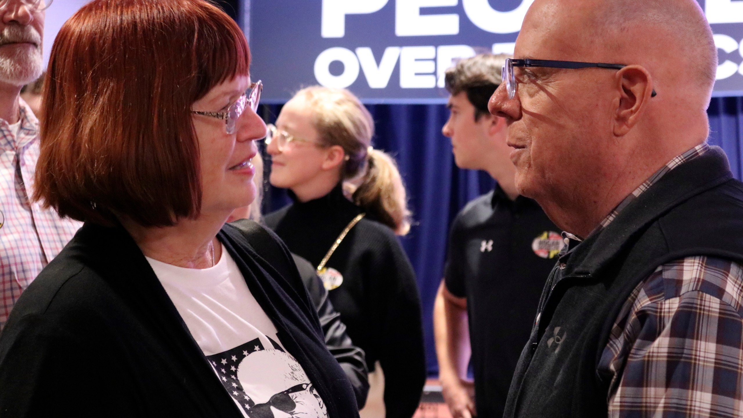 Republican former Gov. Larry Hogan, who is running for U.S. Senate in Maryland, talks to supporter Virginia Umberger during a campaign stop in Millersville, Md., Thursday, Oct. 24, 2024. (AP Photo/Brian Witte)