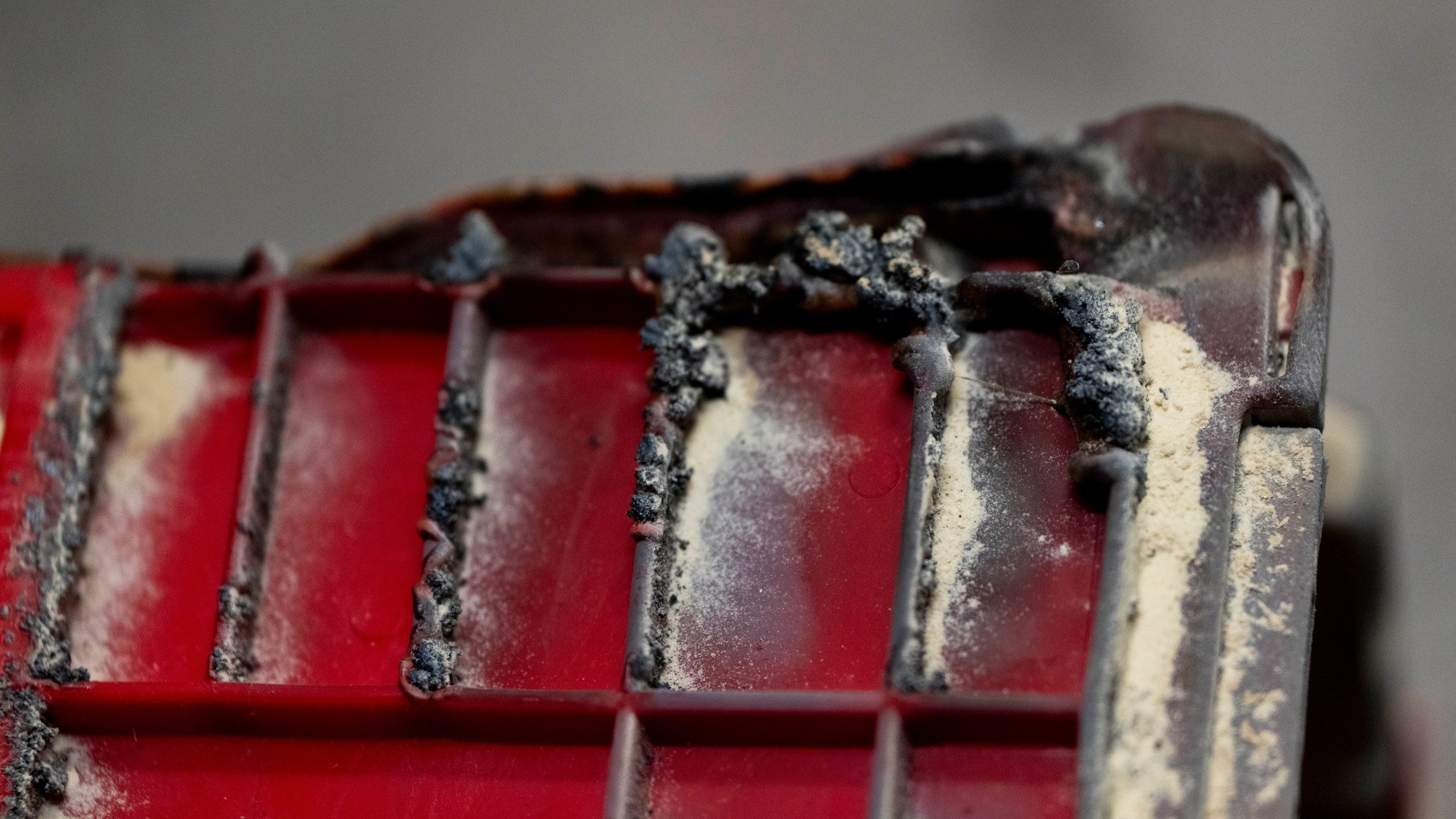 A damaged bin that was in a ballot drop box is displayed at the Multnomah County Elections Office on Monday, Oct. 28, 2024, in Portland, Ore. (AP Photo/Jenny Kane)