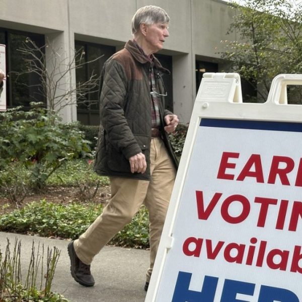 People leave a Georgia polling place on Tuesday, Oct. 15