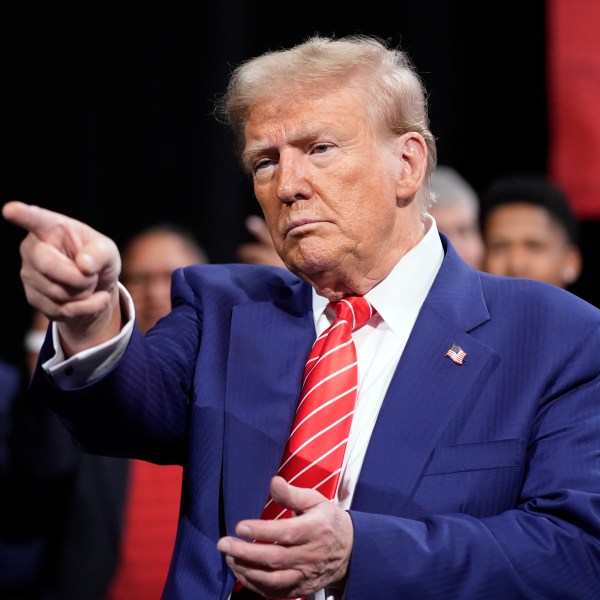 Republican presidential nominee former President Donald Trump gestures at a campaign event at the Cobb Energy Performing Arts Centre