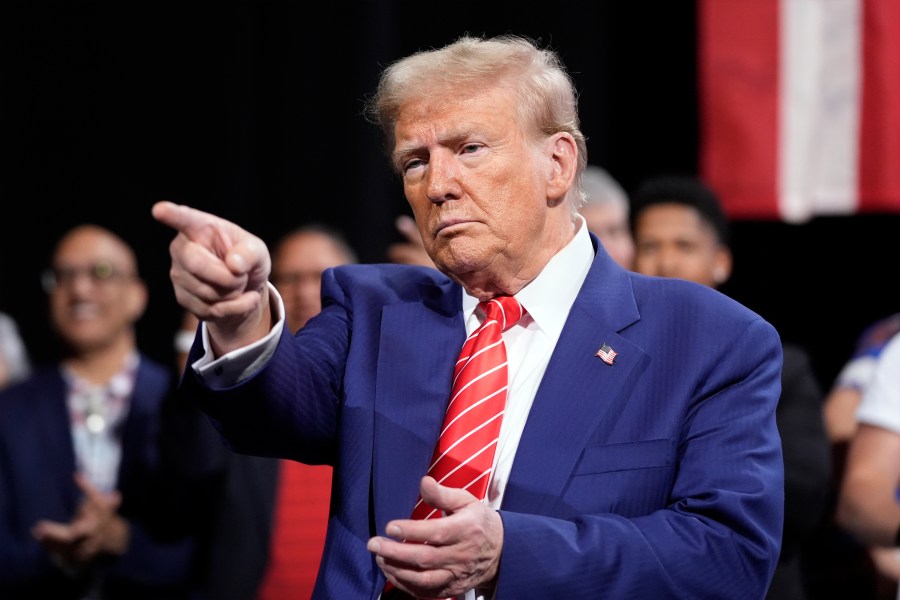 Republican presidential nominee former President Donald Trump gestures at a campaign event at the Cobb Energy Performing Arts Centre
