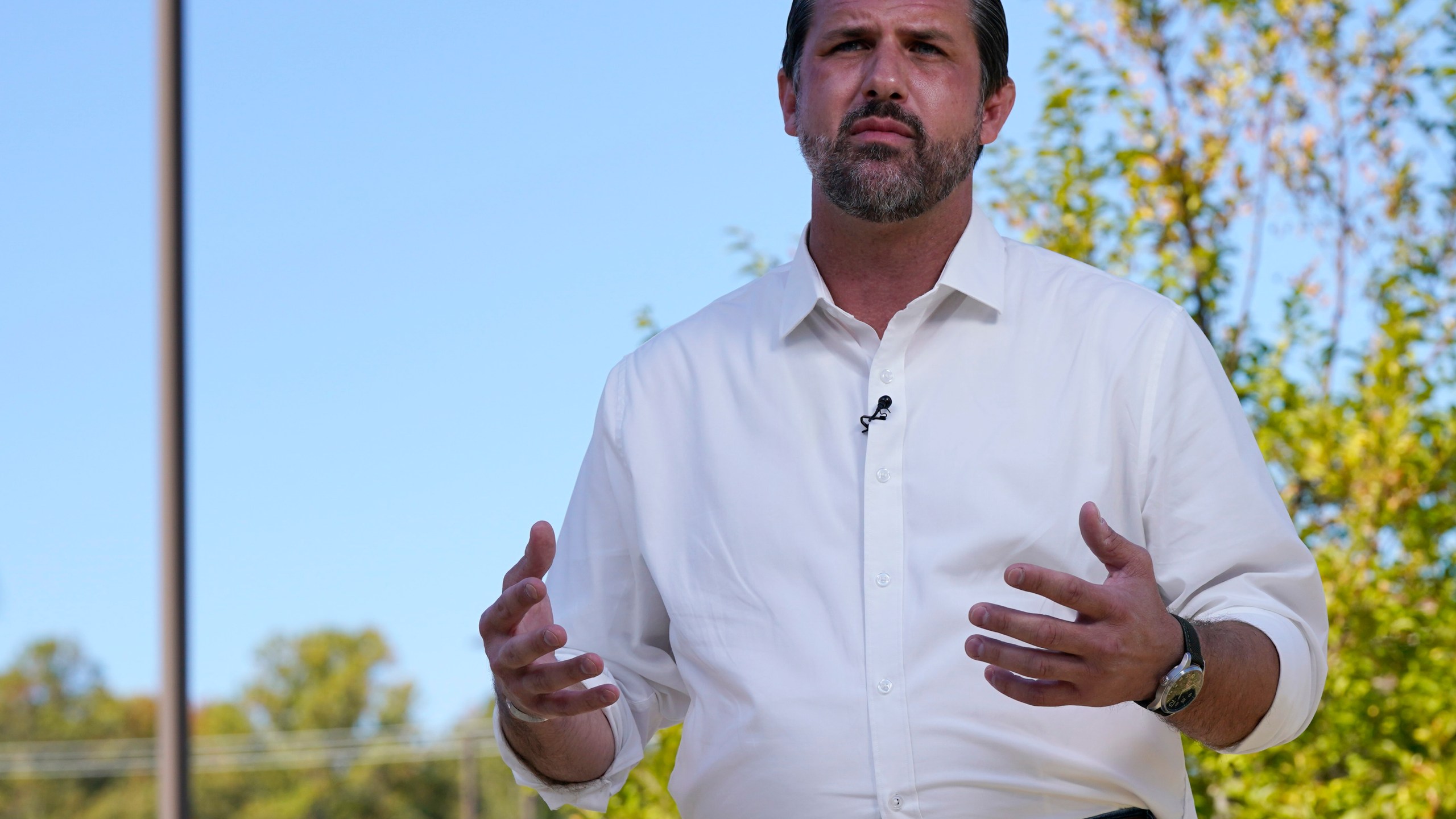 Republican congressional candidate Derrick Anderson gestures during an interview.