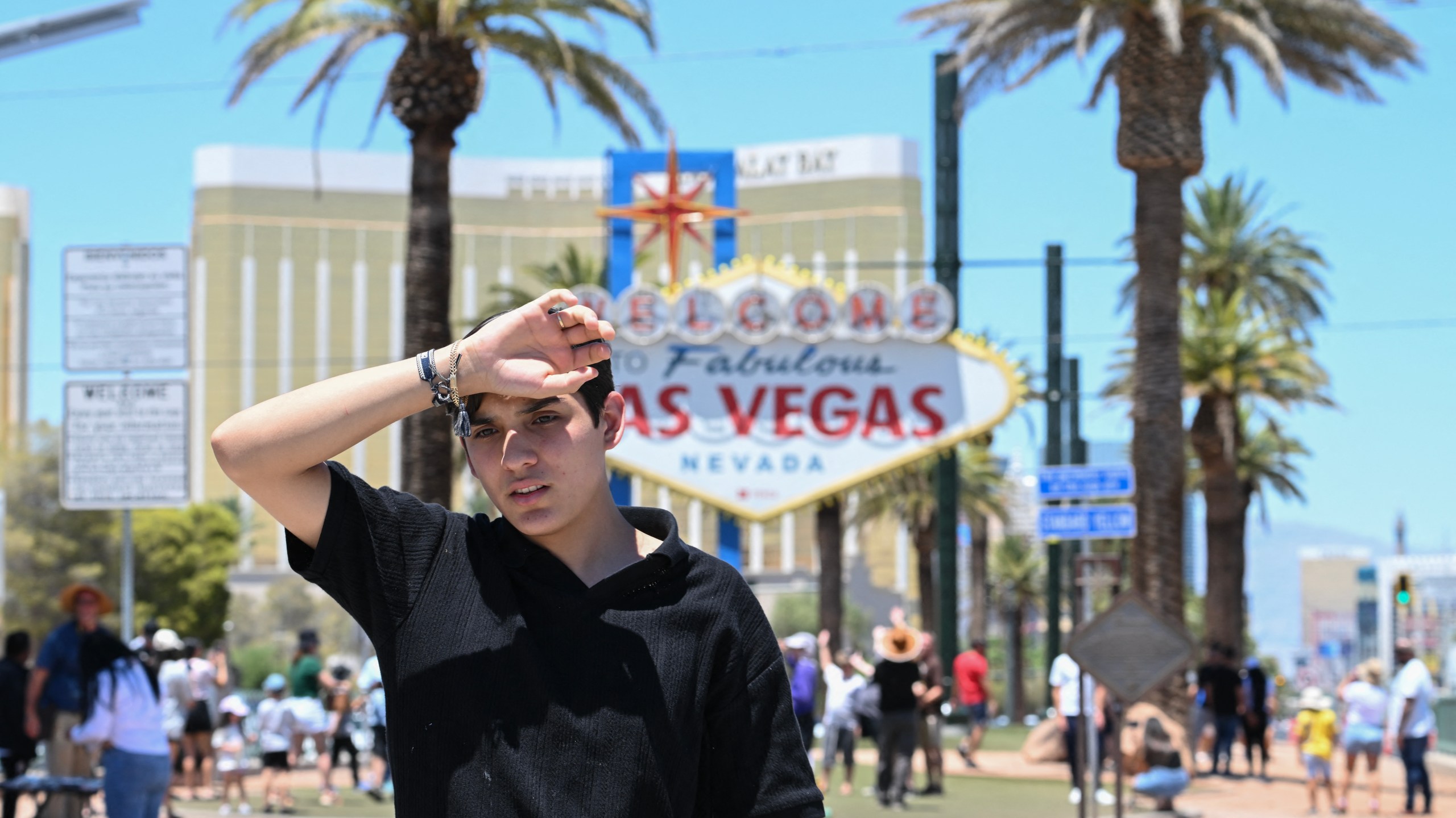 A man walks near the Las Vegas strip during a heatwave in Las Vegas, Nevada in July of 2024.