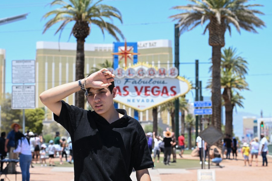 A man walks near the Las Vegas strip during a heatwave in Las Vegas, Nevada in July of 2024.