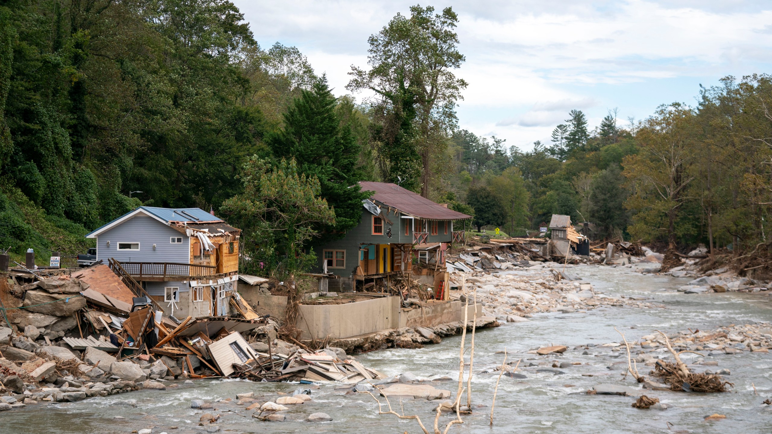 Destroyed houses and buildings along the Broad River in the aftermath of Hurricane Helene on October 1, 2024 in Bat Cave, North Carolina.