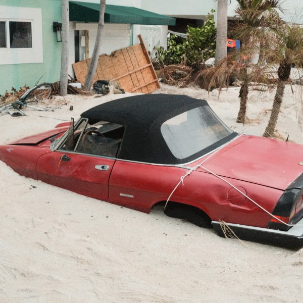 A vehicle stuck in sand after Hurricane Helene.