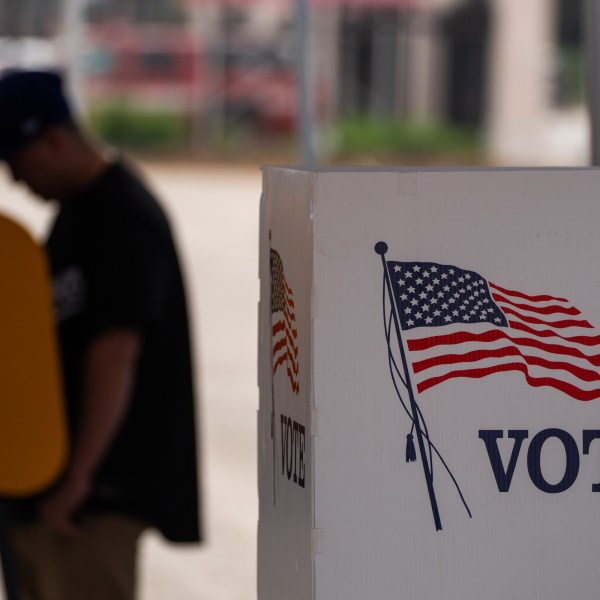 A voter casts ballot during the early voting process at a polling station in California.