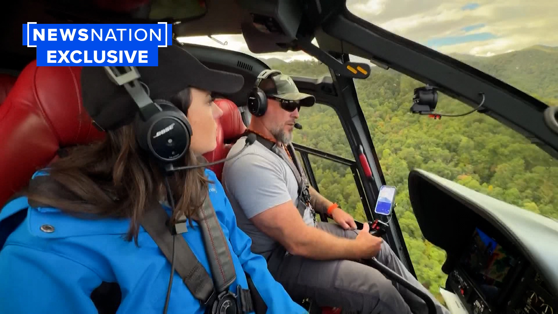 A woman and man in a helicopter