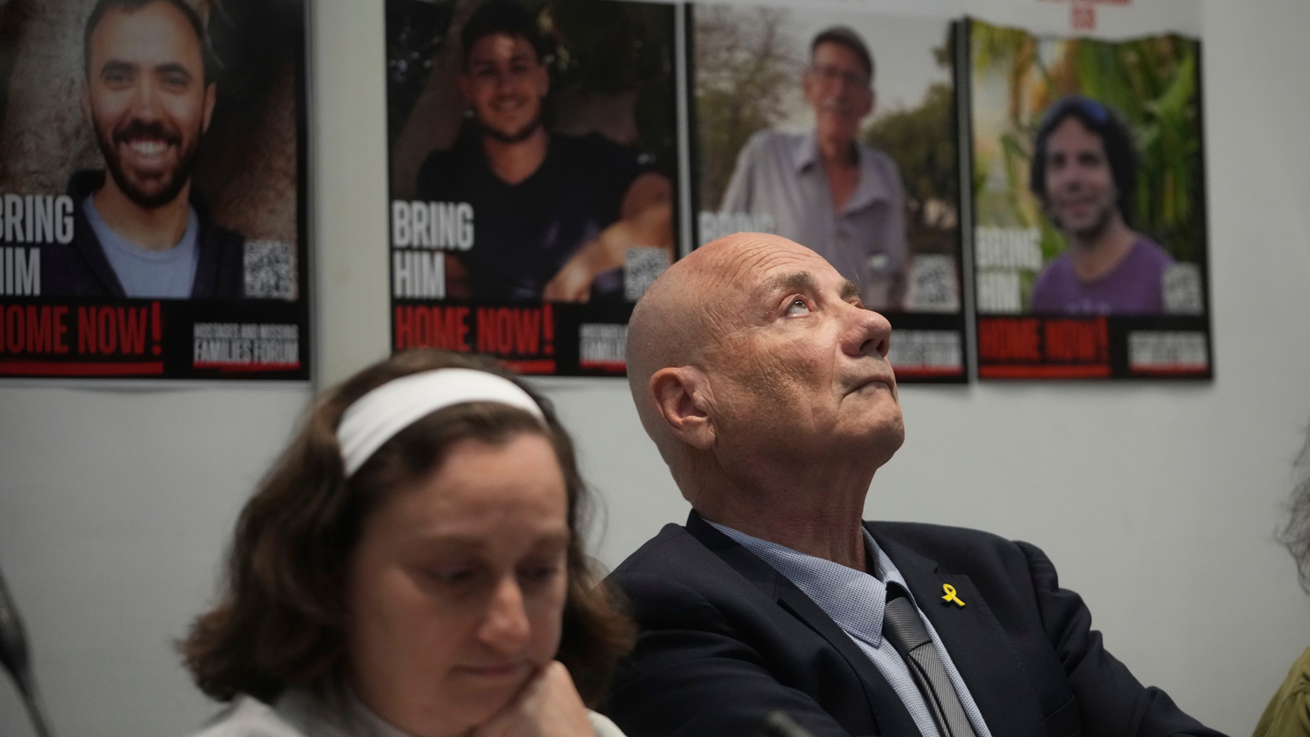 Elena Troufanov, left, and Louis Har, former Israeli hostages and relatives of some still being held by Hamas attend a press conference in Rome, Thursday, Nov. 14, 2024. (AP Photo/Alessandra Tarantino)