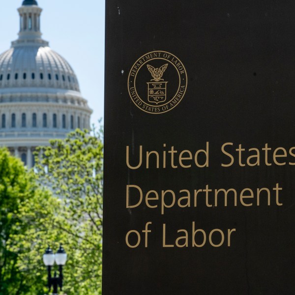 FILE - The entrance to the Labor Department is seen near the Capitol in Washington, Thursday, May 7, 2020. (AP Photo/J. Scott Applewhite, File)