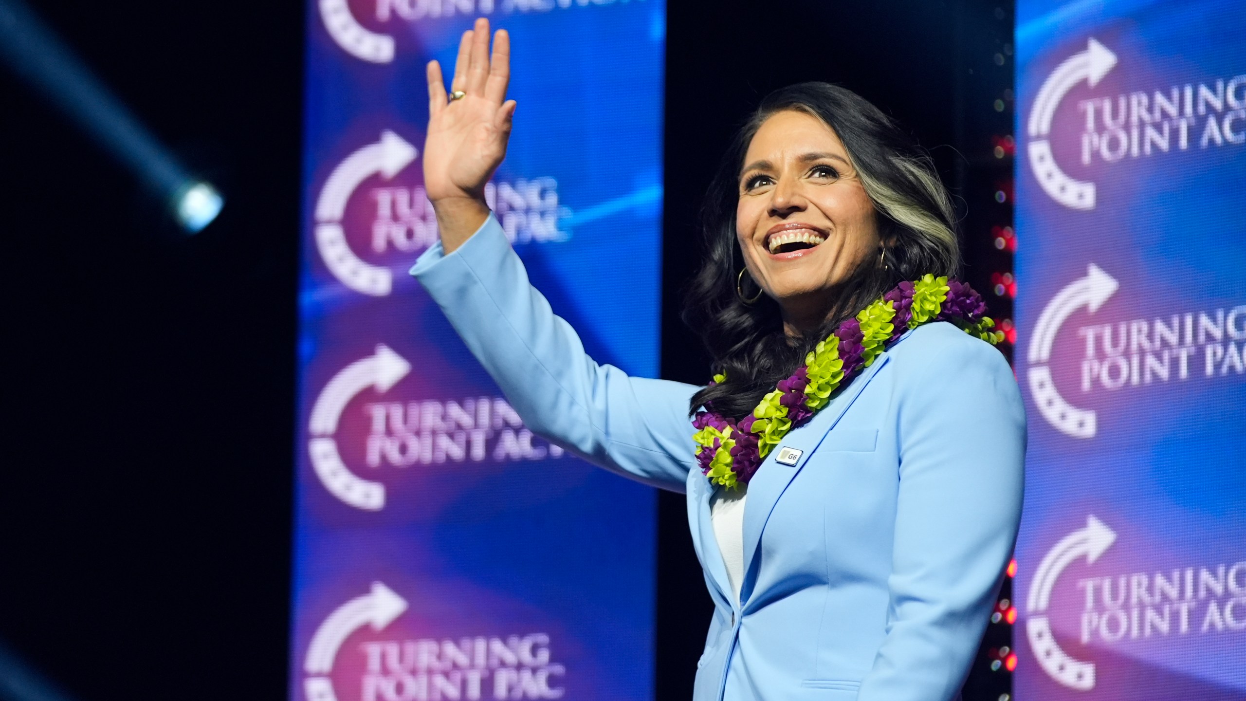 FILE - Former Democratic Rep. Tulsi Gabbard waves as she arrives to speak before Republican presidential nominee former President Donald Trump during a campaign rally at Thomas & Mack Center, Oct. 24, 2024, in Las Vegas. (AP Photo/Alex Brandon, File)