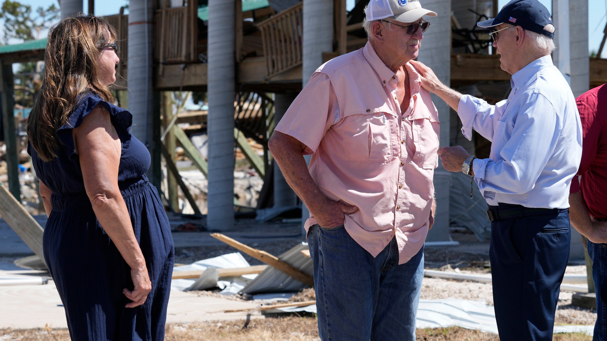 FILE - President Joe Biden, right, greets people in Keaton Beach, Fla., Oct. 3, 2024, during his tour of areas impacted by Hurricane Helene. (AP Photo/Susan Walsh, File)