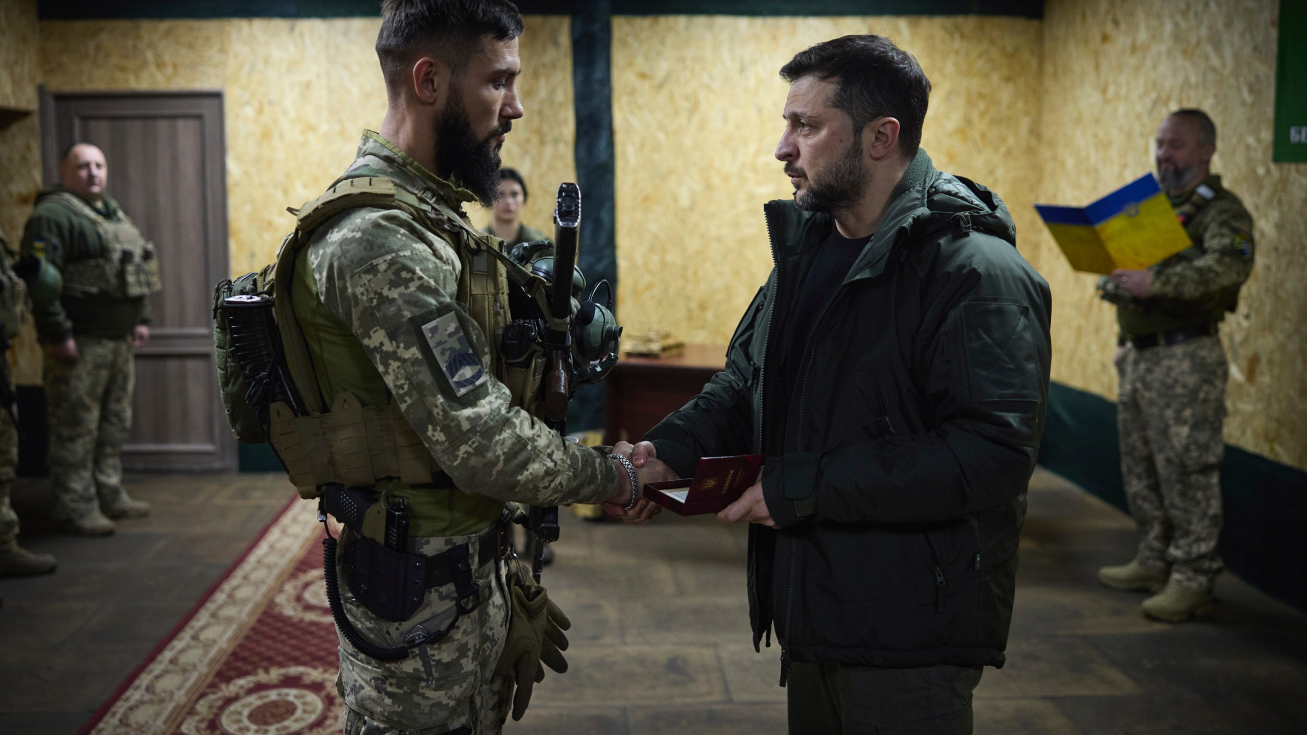 In this photo provided by the Ukrainian Presidential Press Office, Ukrainian President Volodymyr Zelenskyy awards servicemen in the frontline city of Kupiansk, the site of heaviest battles with the Russian troops in the Kharkiv region, Ukraine, Monday, Nov. 18, 2024. (Ukrainian Presidential Press Office via AP)