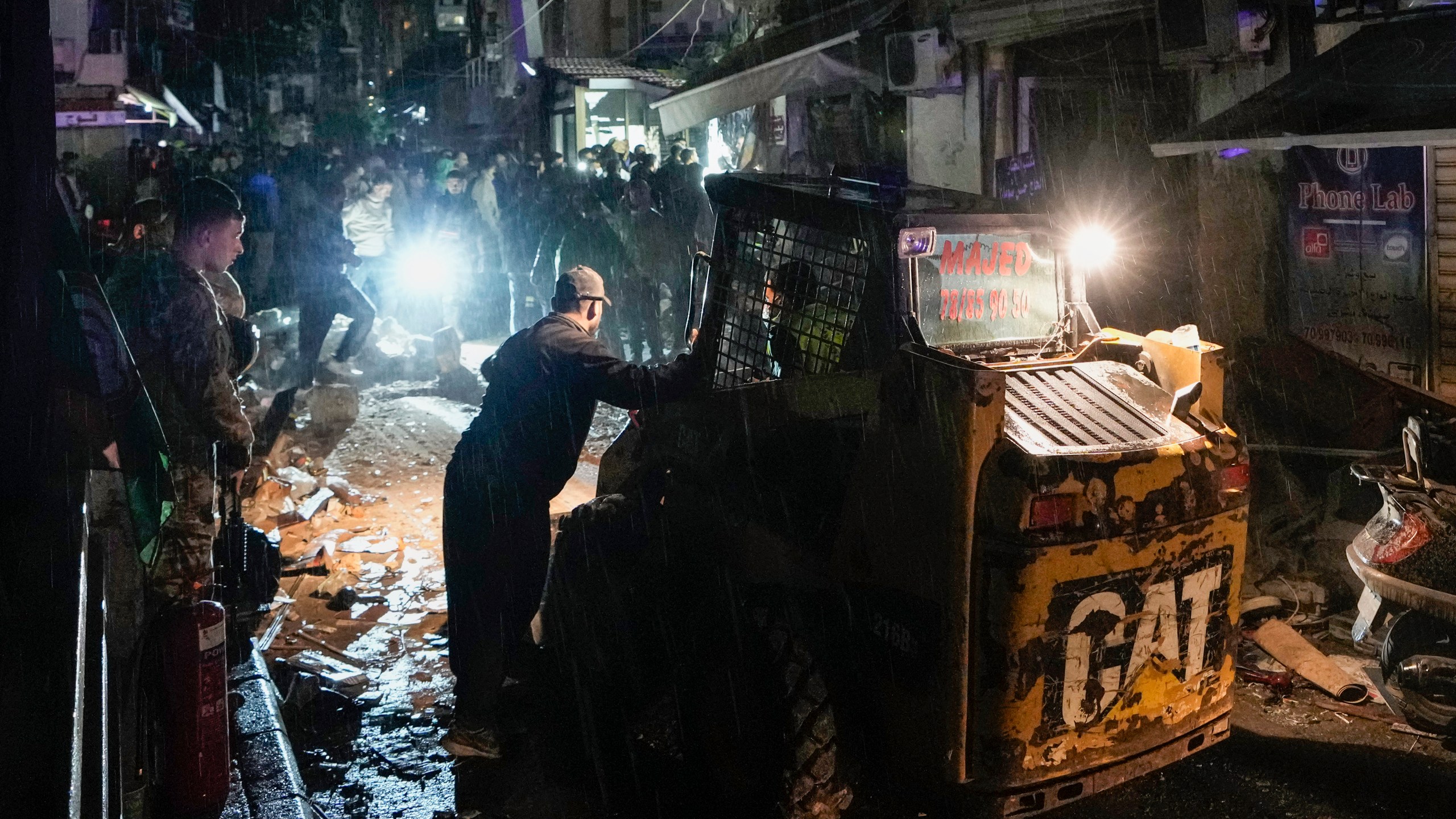 Rescue workers work at the site of an Israeli airstrike in Beirut, Lebanon, Monday, Nov. 18, 2024. (AP Photo/Bilal Hussein)