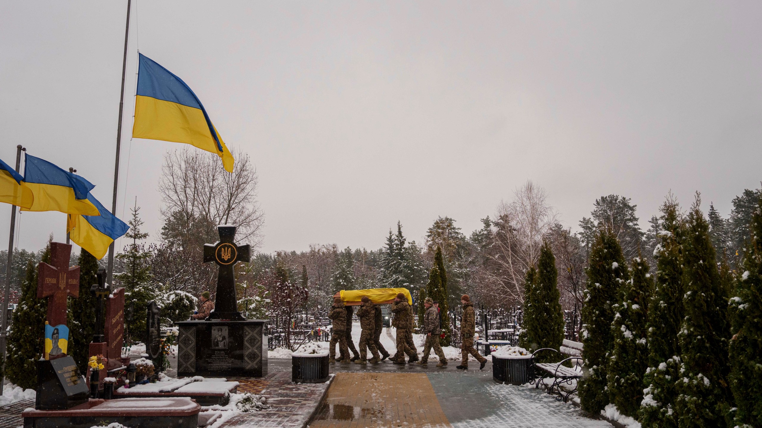 Honor Guards carry the coffin of fallen Ukrainian serviceman of the 47th brigade Serhii Solovyov, who was killed during fighting with Russian Forces in Kursk oblast on November 12, during the funeral ceremony in Irpin, Kyiv region, Ukraine, Nov. 21, 2024. (AP Photo/Evgeniy Maloletka)
