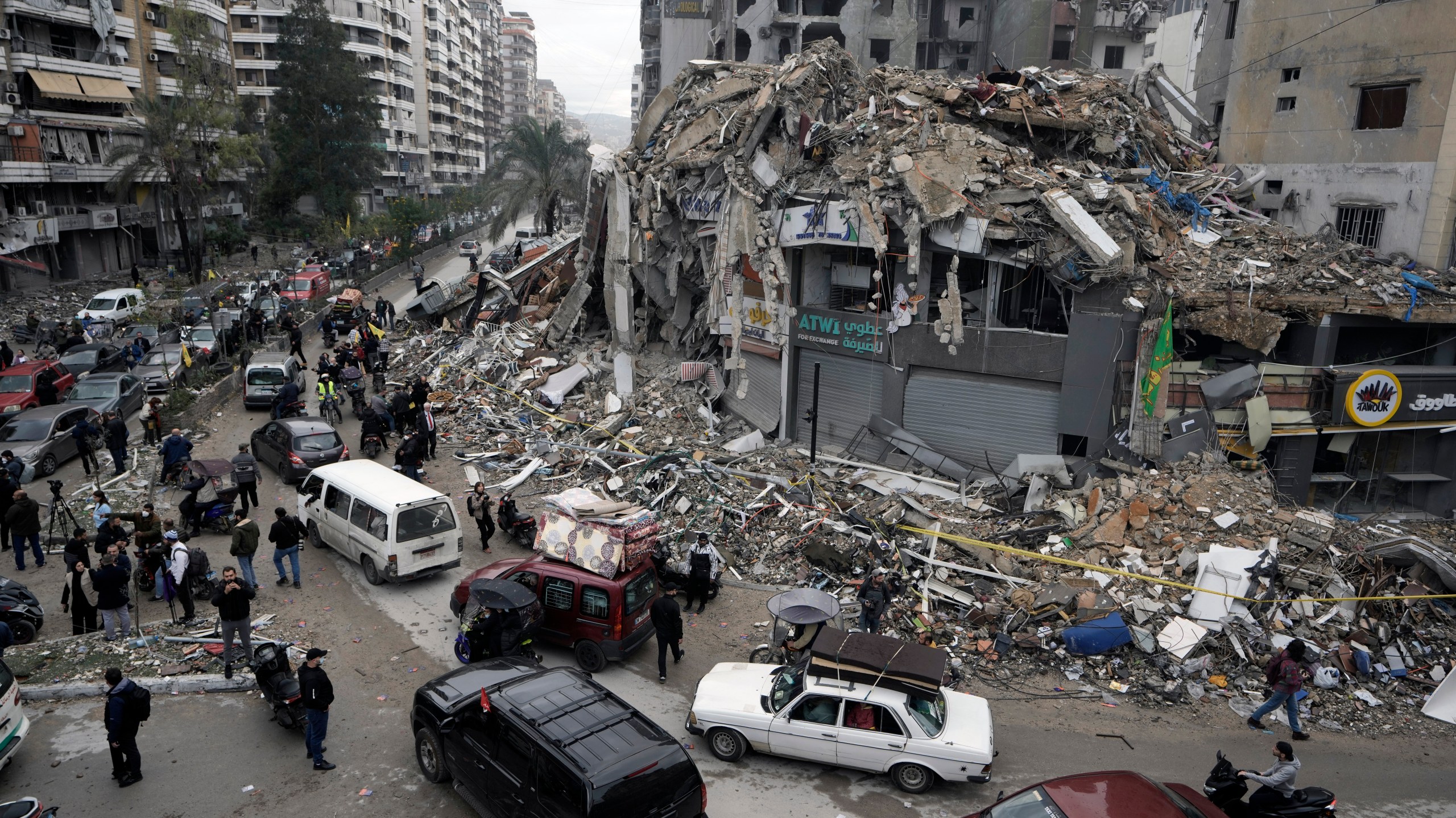 Displaced residents return to Dahiyeh, in Beirut, Lebanon, following a ceasefire between Israel and Hezbollah that went into effect, Nov. 27, 2024. (AP Photo/Bilal Hussein)