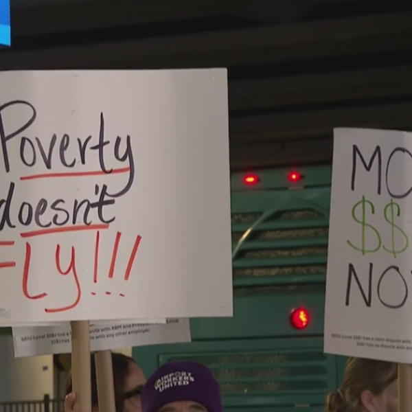 Workers protest at Charlotte Douglas Airport on Monday.