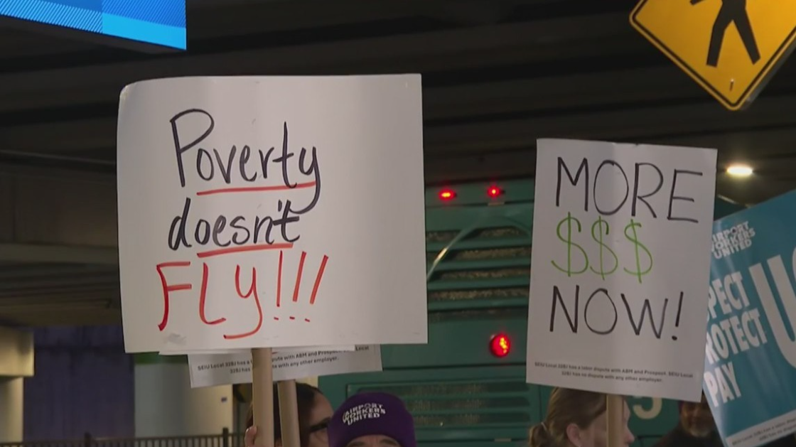 Workers protest at Charlotte Douglas Airport on Monday.