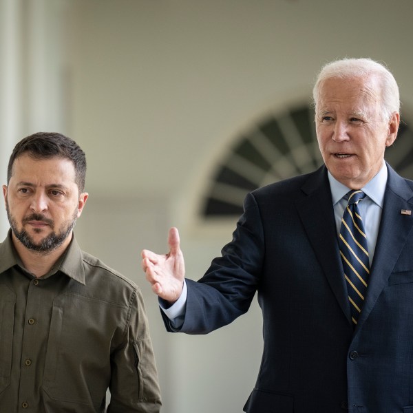 President Joe Biden walks with Ukrainian President Volodymyr Zelenskyy.