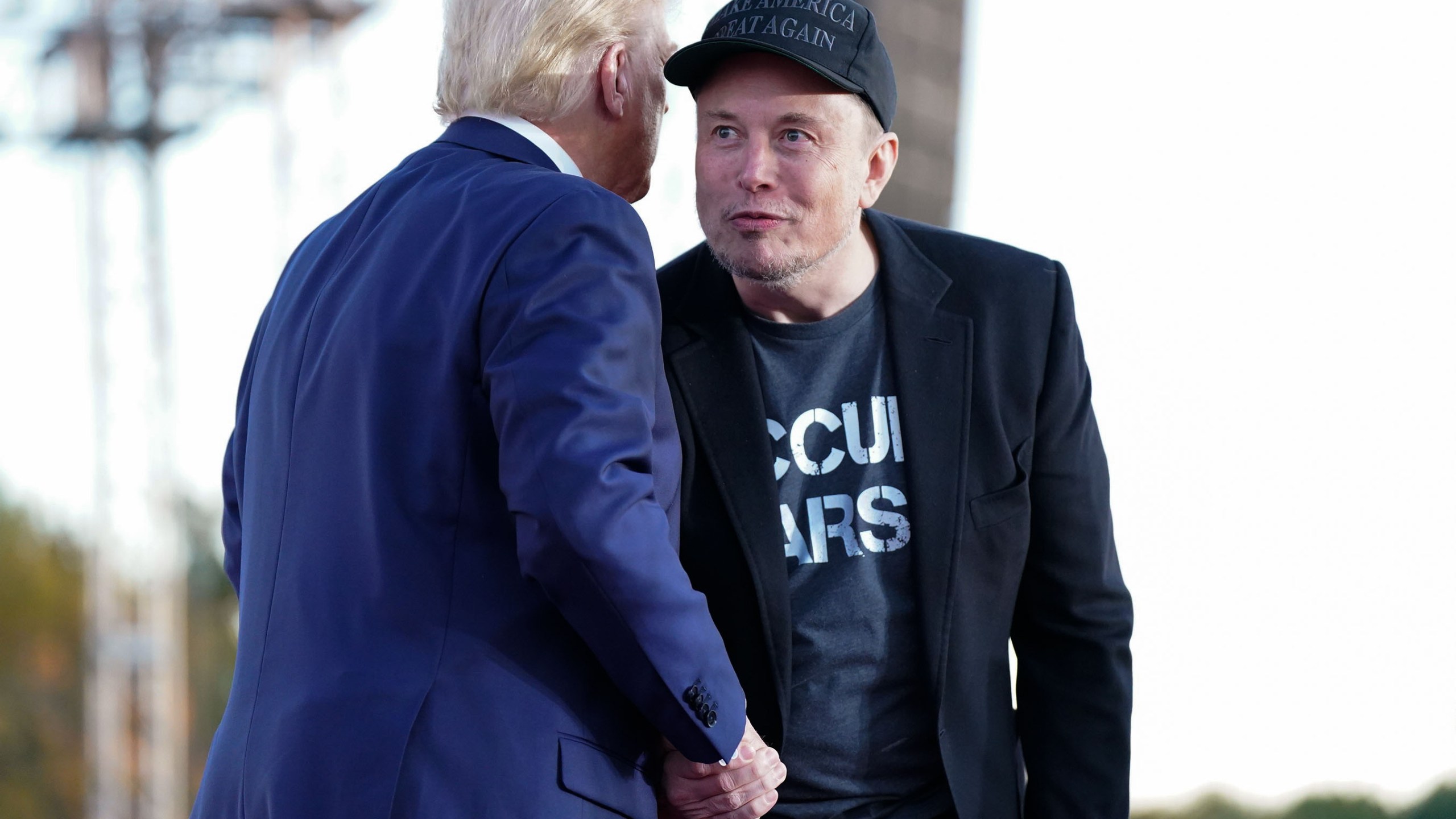 Elon Musk and Donald Trump at a rally.