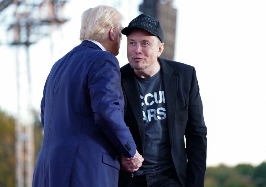 Elon Musk and Donald Trump at a rally.