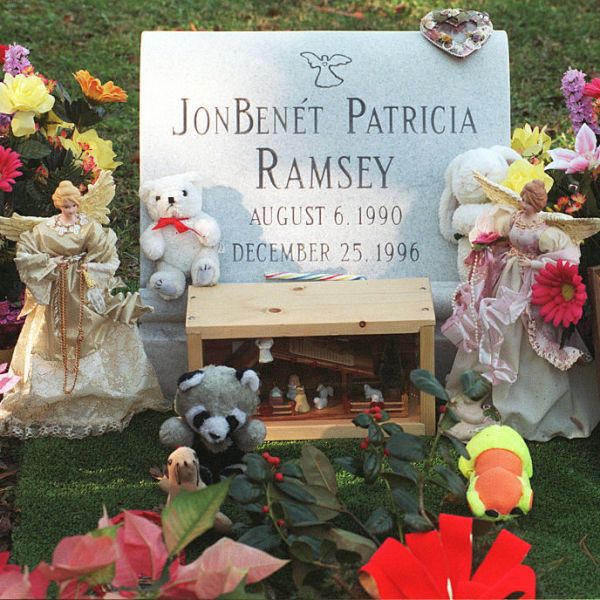 The grave of JonBenet Ramsey, surrounded by flowers.