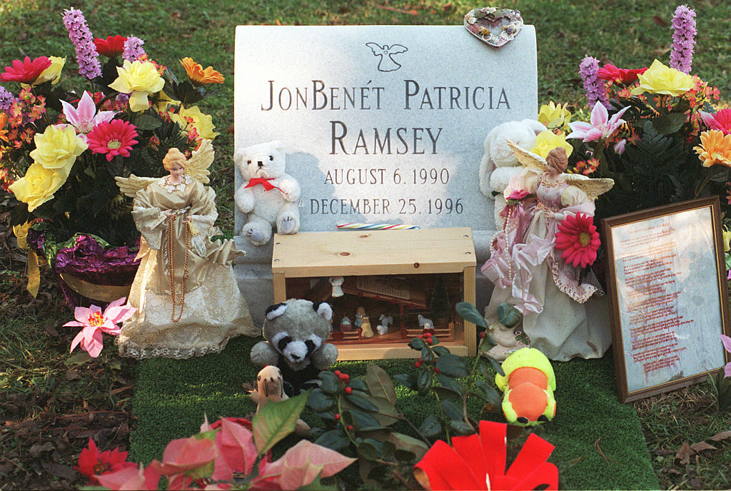 The grave of JonBenet Ramsey, surrounded by flowers.