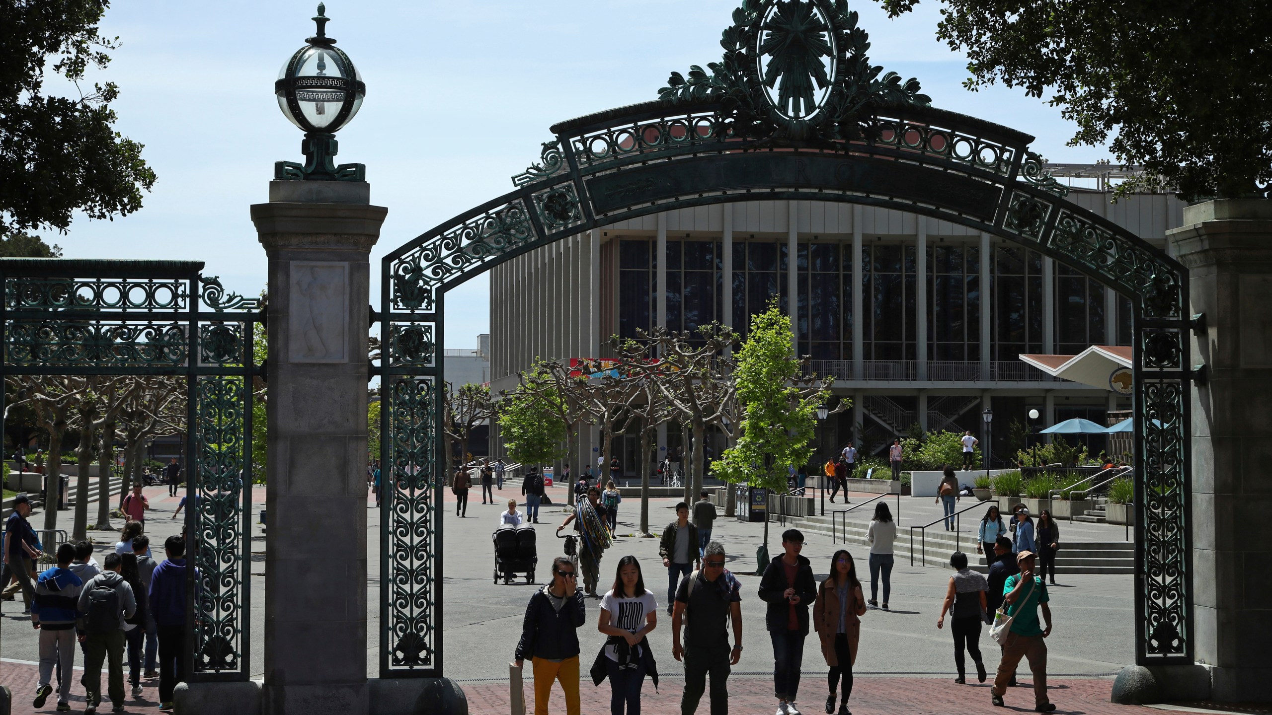 FILE - Students walk past Sather Gate on the University of California at Berkeley campus in Berkeley, Calif., May 10, 2018. (AP Photo/Ben Margot, File)