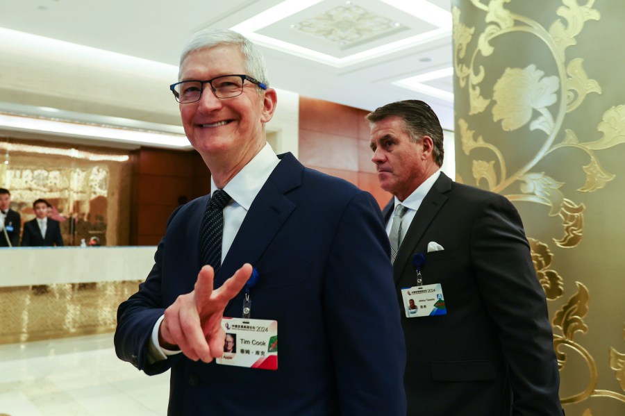 FILE - Apple CEO Tim Cook reacts at the annual meeting of the China Development Forum at the Diaoyutai Guesthouse in Beijing, China, March 24, 2024. (Wu Hao/Pool Photo via AP, File)