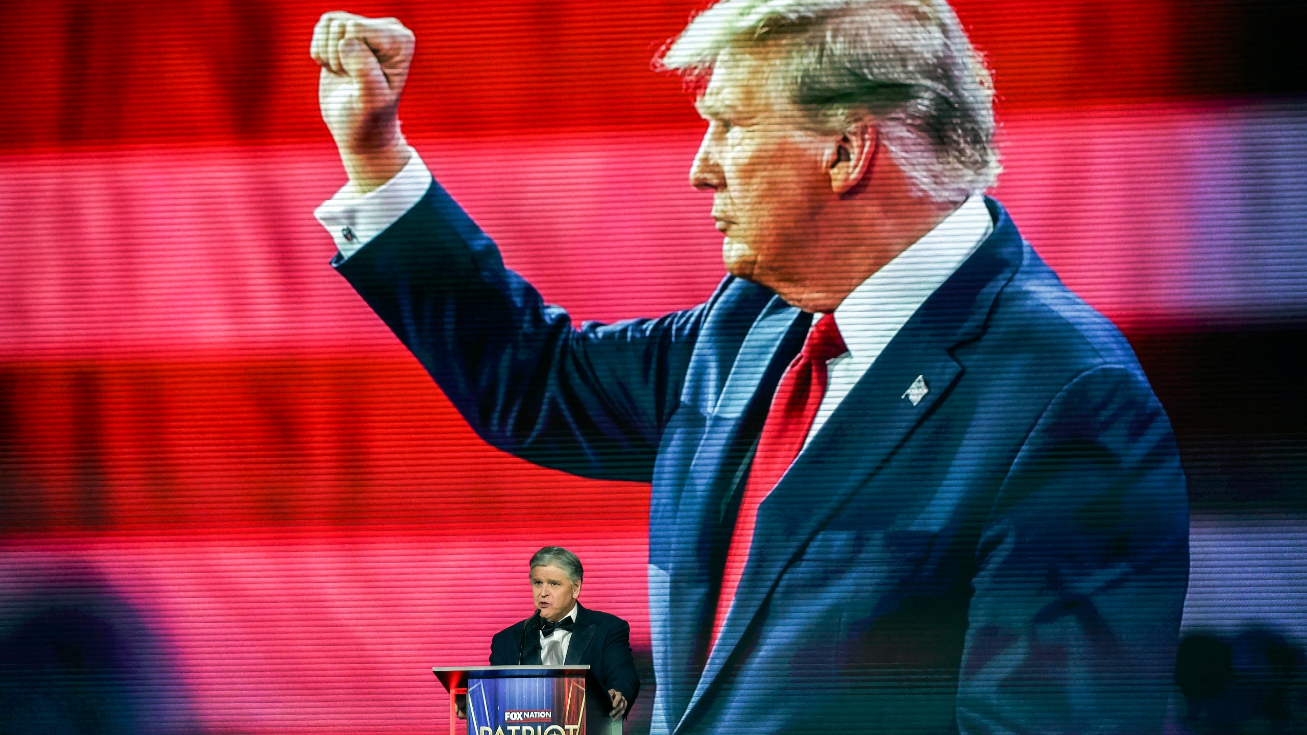Sean Hannity introduces President-elect Donald Trump before awarding him the 'Patriot of the Year' award at the FOX Nation Patriot Awards, Thursday, Dec. 5, 2024, in Greenvale, N.Y. (AP Photo/Heather Khalifa)