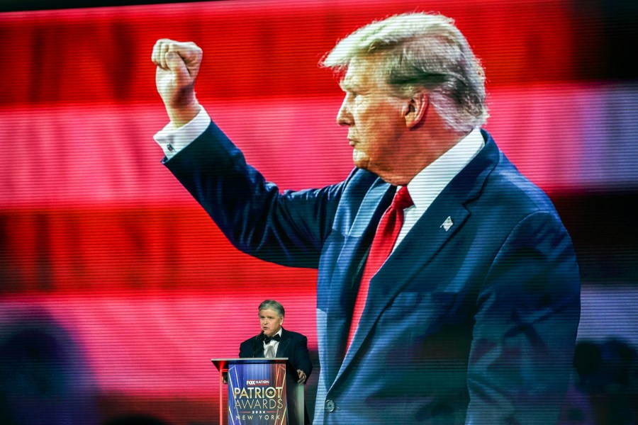 Sean Hannity introduces President-elect Donald Trump before awarding him the 'Patriot of the Year' award at the FOX Nation Patriot Awards, Thursday, Dec. 5, 2024, in Greenvale, N.Y. (AP Photo/Heather Khalifa)