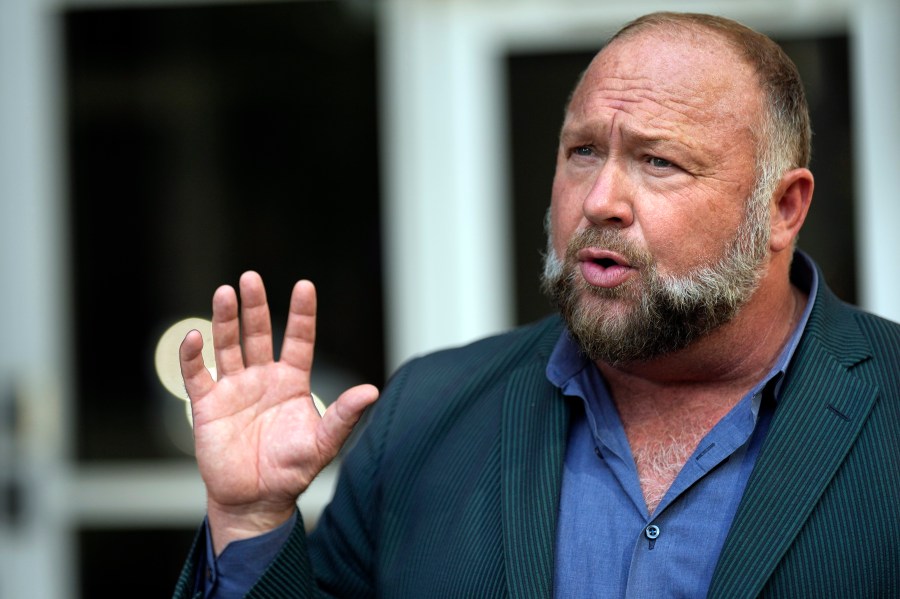 FILE - Right-wing conspiracy theorist Alex Jones speaks outside the federal courthouse after a bankruptcy hearing Friday, June 14, 2024, in Houston. (AP Photo/David J. Phillip, File)