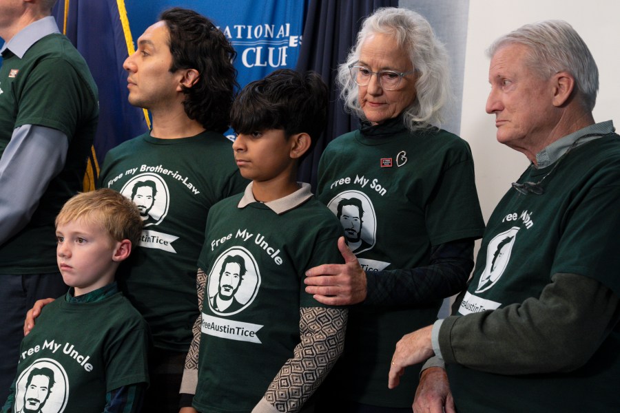 Debra Tice, second right, and Marc Tice, right, the parents of Austin Tice, a journalist who was kidnapped in Syria, listen with their son-in-law and grandchildren during a news conference updating the media about their son's condition as they continue to push for his release, Friday, Dec. 6, 2024, at the National Press Club in Washington. (AP Photo/Jacquelyn Martin)
