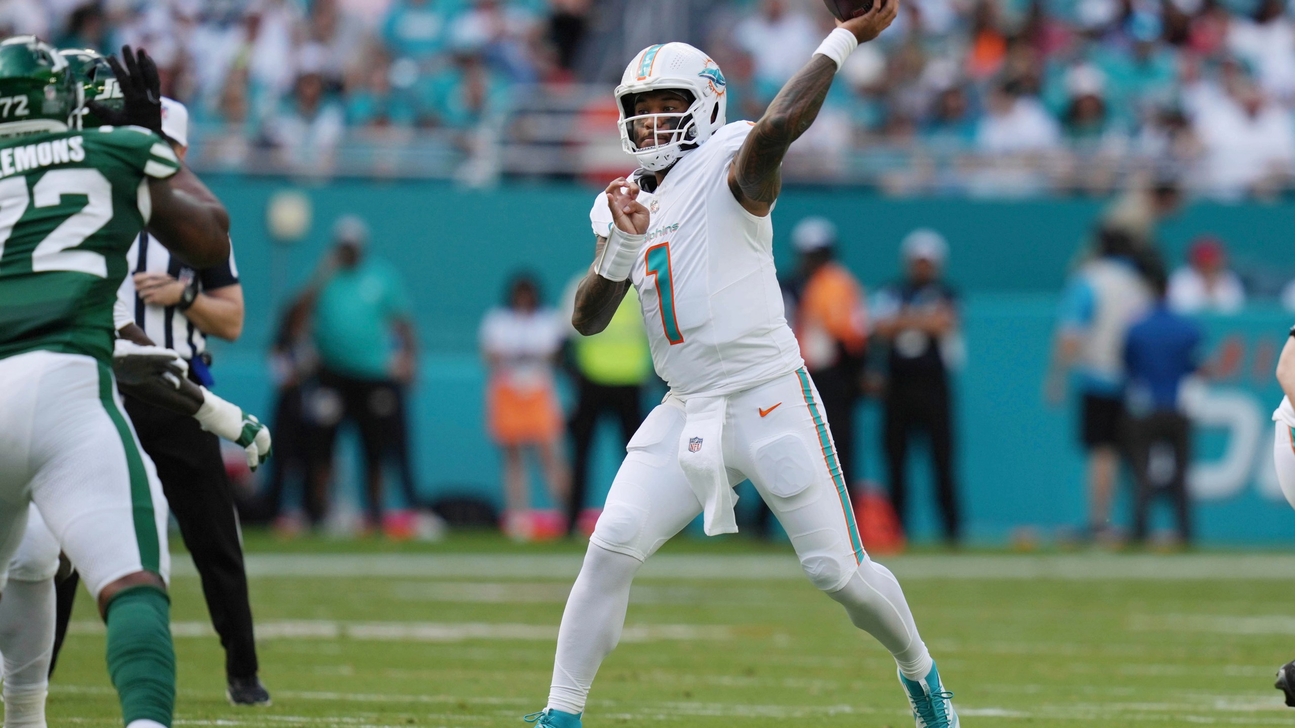 Miami Dolphins quarterback Tua Tagovailoa (1) aims a pass during the first half of an NFL football game against the New York Jets, Sunday, Dec. 8, 2024, in Miami Gardens, Fla. (AP Photo/Lynne Sladky)